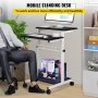 Escritorio móvil VEVOR con monitor, teclado y material de oficina, junto a una persona sentada con traje.