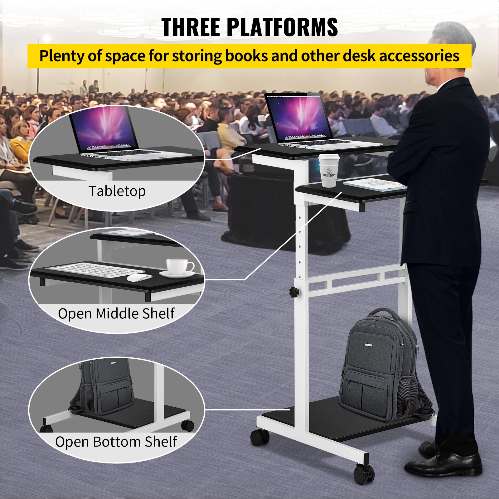 Escritorio móvil VEVOR con tres plataformas para computadora portátil, libros y accesorios en un entorno de conferencia.