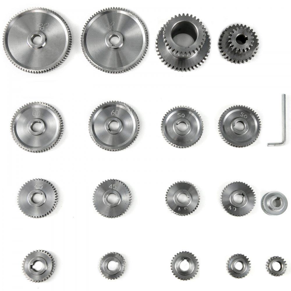 Varios engranajes de metal y piezas de herramientas para mini tornos VEVOR, engranajes dispuestos en filas.