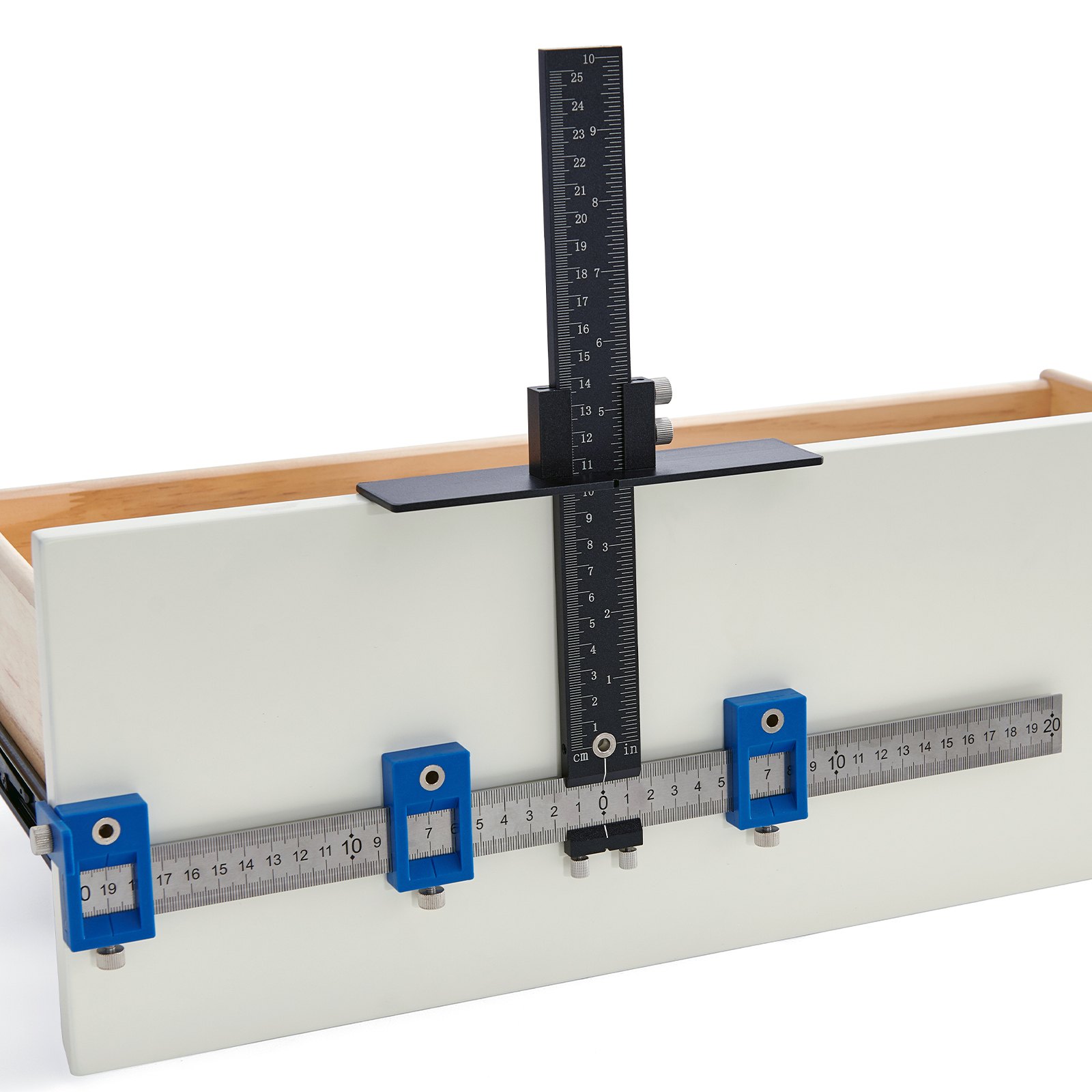 Configuración de plantilla de herrajes para gabinetes VEVOR en un frente de cajón blanco, con guías de medición ajustables azules.