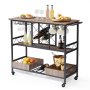 Carrito de bar VEVOR con botellero para vinos, copas, bebidas, frutas y snacks sobre una superficie de madera.