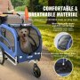 Perro en un remolque de bicicleta para perros VEVOR azul con malla transpirable, lona impermeable y base antideslizante.