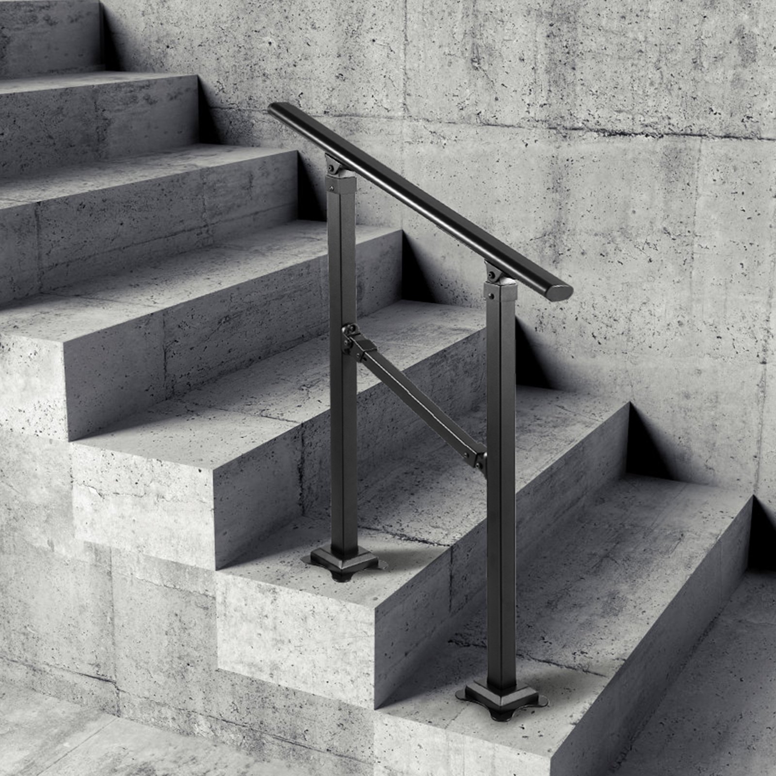Barandilla de escalera exterior VEVOR negra instalada en escaleras de hormigón con pared texturizada.