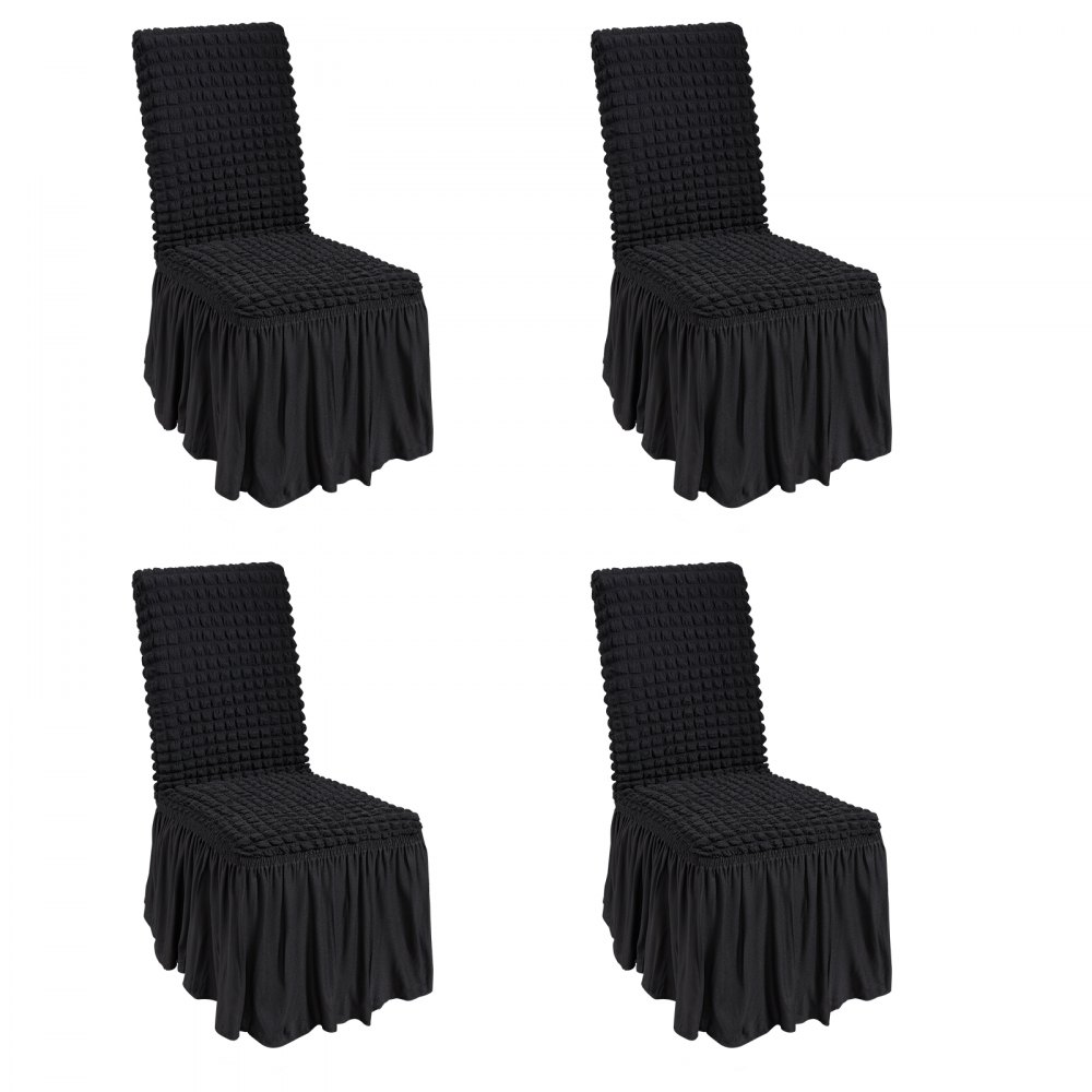 Cuatro fundas de silla elásticas de spandex VEVOR negras con respaldos texturizados y faldas con volantes.