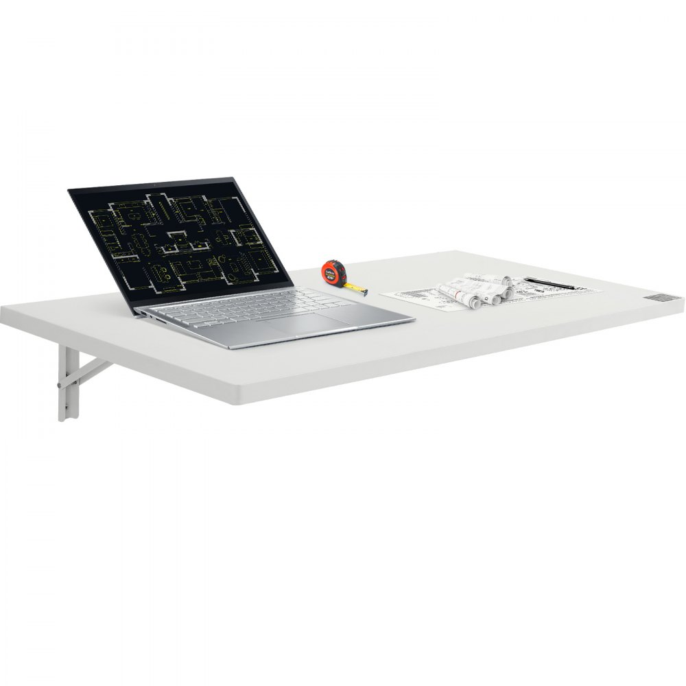 Table pliante murale VEVOR avec ordinateur portable, ruban à mesurer et plans roulés sur une surface blanche.