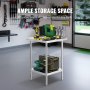 Table de préparation en acier inoxydable VEVOR avec outils dans un garage bien organisé, présentant un grand espace de rangement.