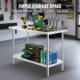 Table de travail en acier inoxydable VEVOR dans un garage avec outils, perceuse et bombes aérosols soigneusement organisés.