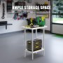 Table de préparation en acier inoxydable VEVOR avec outils organisés dans un garage, mettant en valeur un grand espace de rangement.