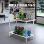 Table de préparation en acier inoxydable VEVOR avec outils et fournitures dans un atelier de garage bien organisé.