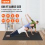 Tapis d'exercice VEVOR 8x6 pieds utilisé pour le yoga, le hiit et plus encore par une famille dans une salle de sport à domicile.