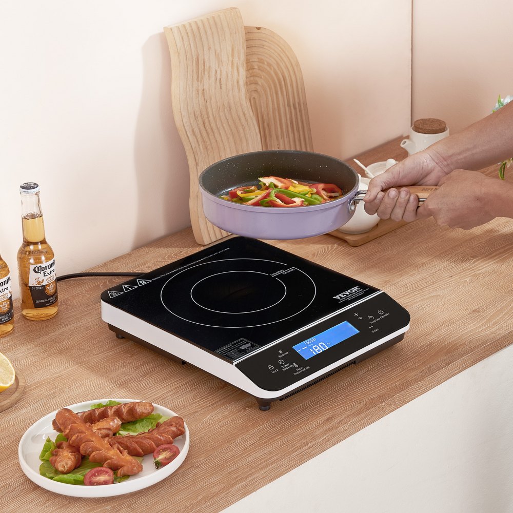 VEVOR portable induction cooktop (290 x 355 x 65 mm) 2200 W with 9 temperature settings. Cooktop compatible with magnetic cookware (up to 24 cm diameter).
