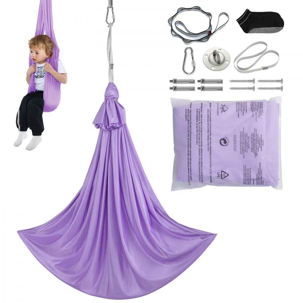 bambino che utilizza un'altalena sensoriale VEVOR viola, il contenuto della confezione è sparso, compresi accessori e cinghie.