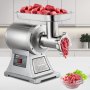 Picadora de carne comercial VEVOR que muele carne en una cocina moderna.