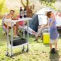 Niños junto a una parrilla al aire libre con una mesa de trabajo de acero inoxidable VEVOR sosteniendo dos botellas de vino y un plato.