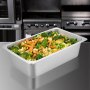 Sartenes de vapor VEVOR llenas de verduras mixtas en una cocina comercial.