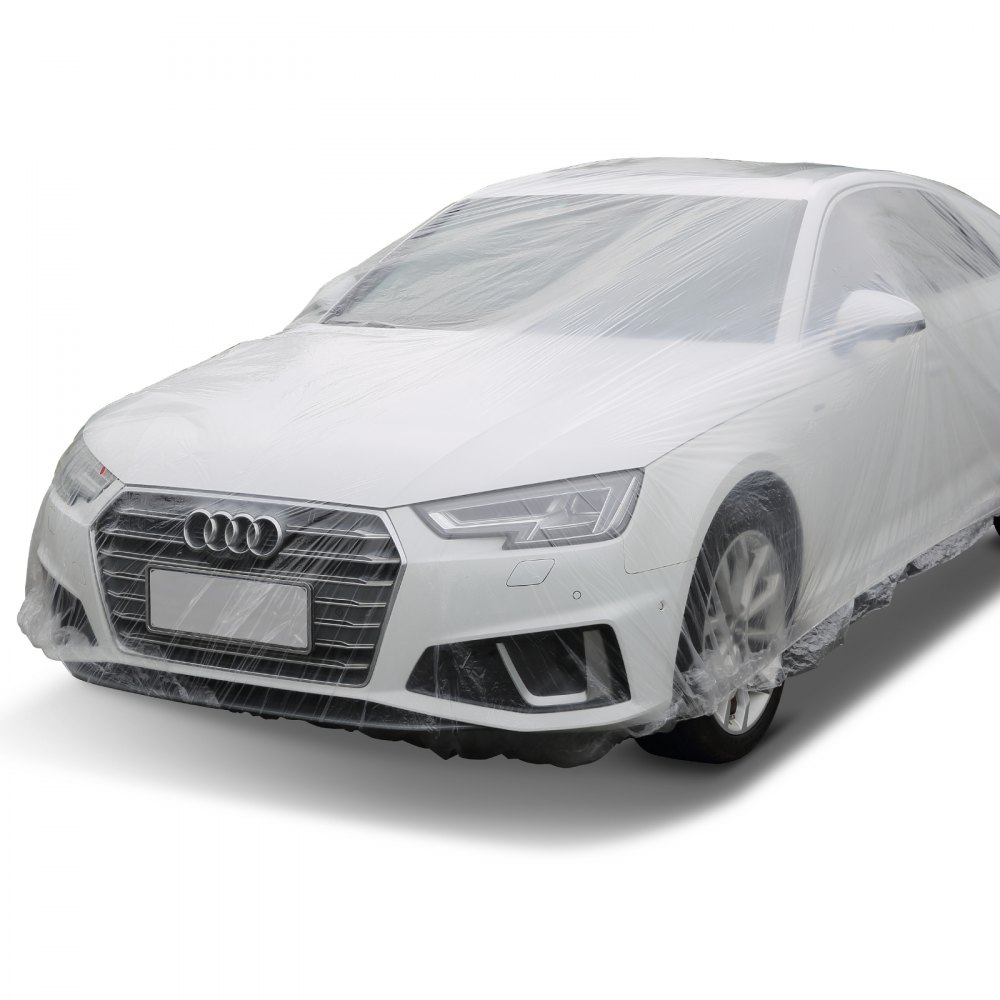 Coche blanco cubierto con una funda VEVOR, que ofrece protección para todo el cuerpo.