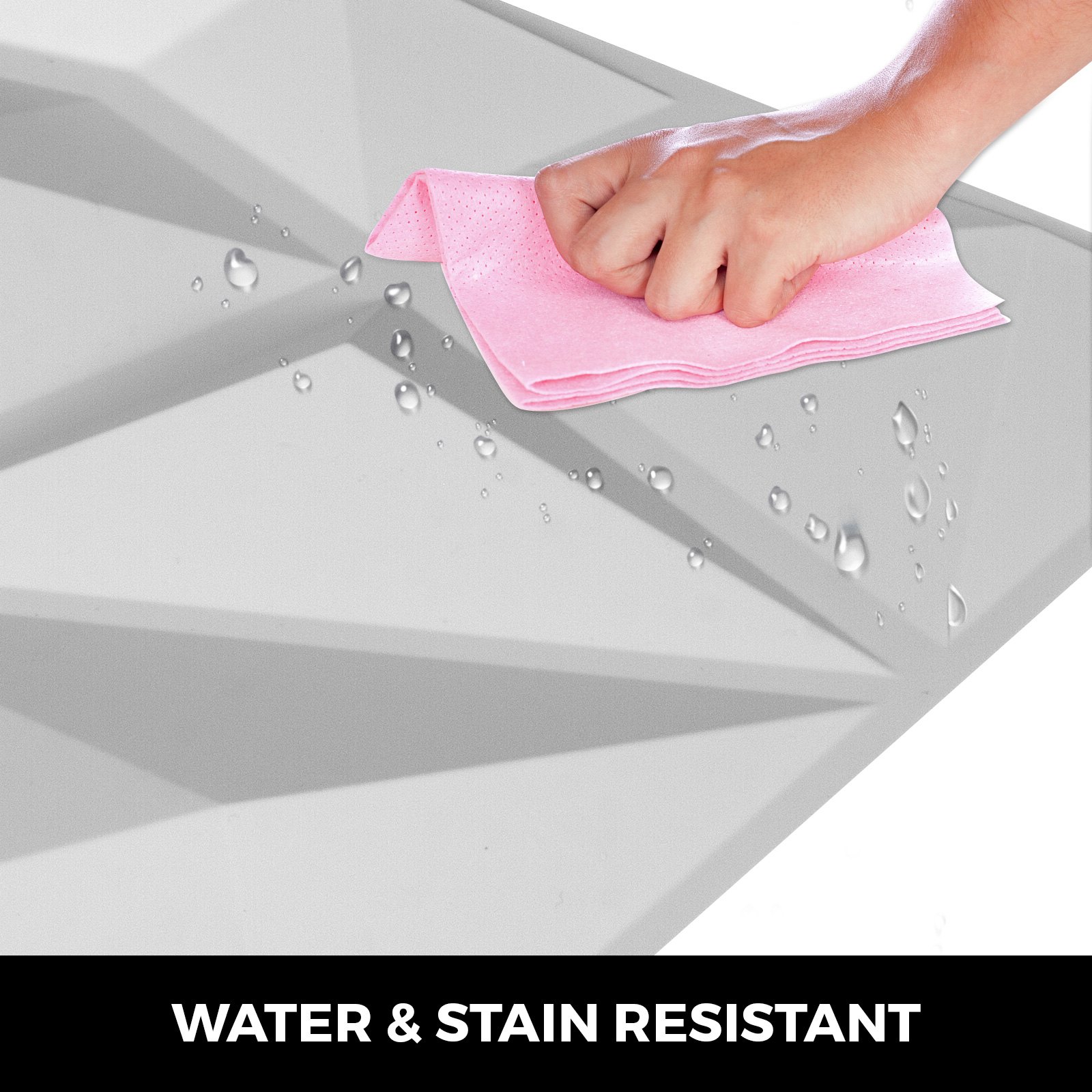 Limpiando a mano los paneles de pared 3D VEVOR con un paño rosa, demostrando su resistencia al agua.