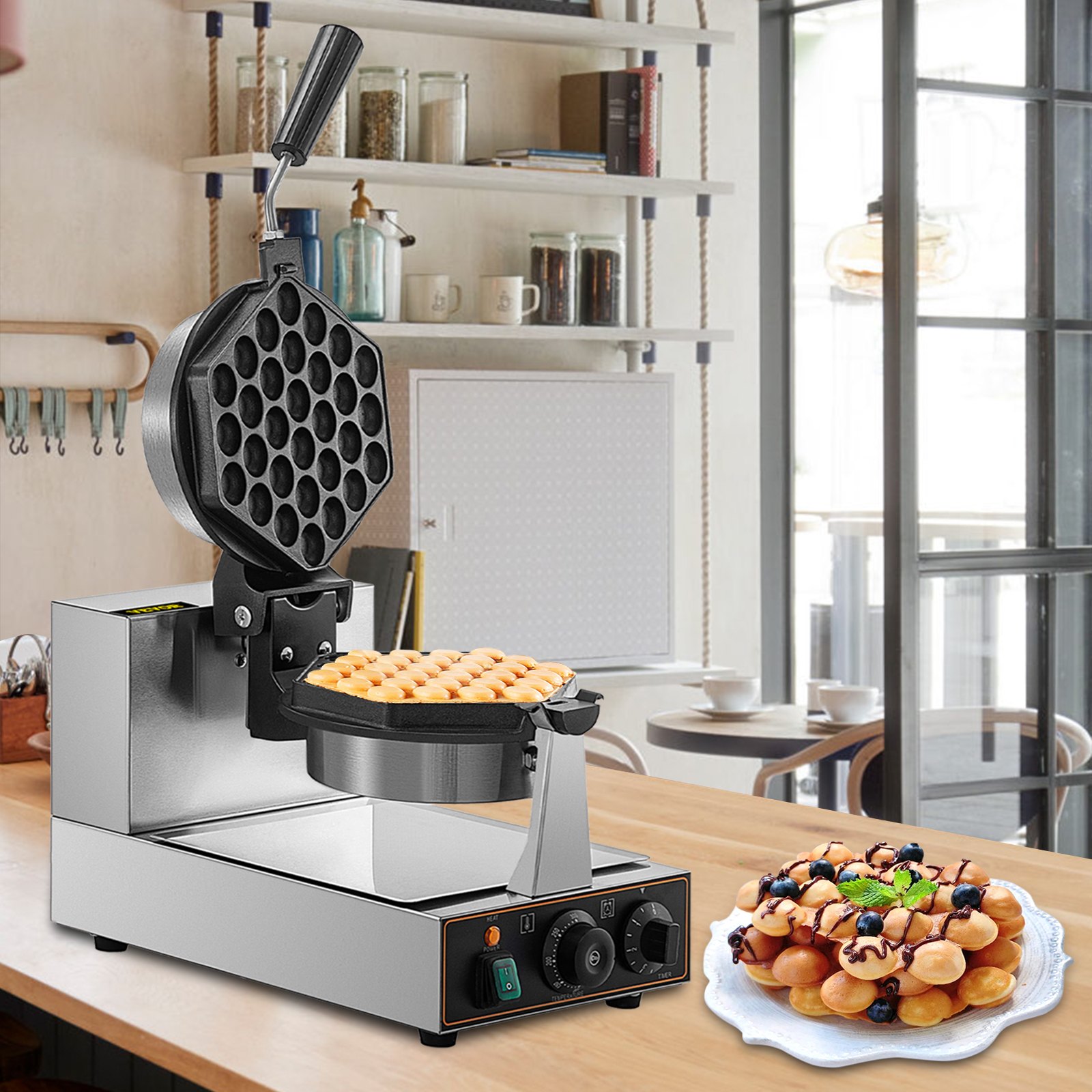 Máquina para hacer waffles de burbujas VEVOR sobre una encimera de cocina con un plato de waffles de burbujas cubiertos con arándanos.