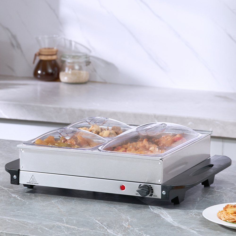 Servidor de buffet eléctrico VEVOR con bandejas de comida sobre encimera de cocina y protector contra salpicaduras de mármol.