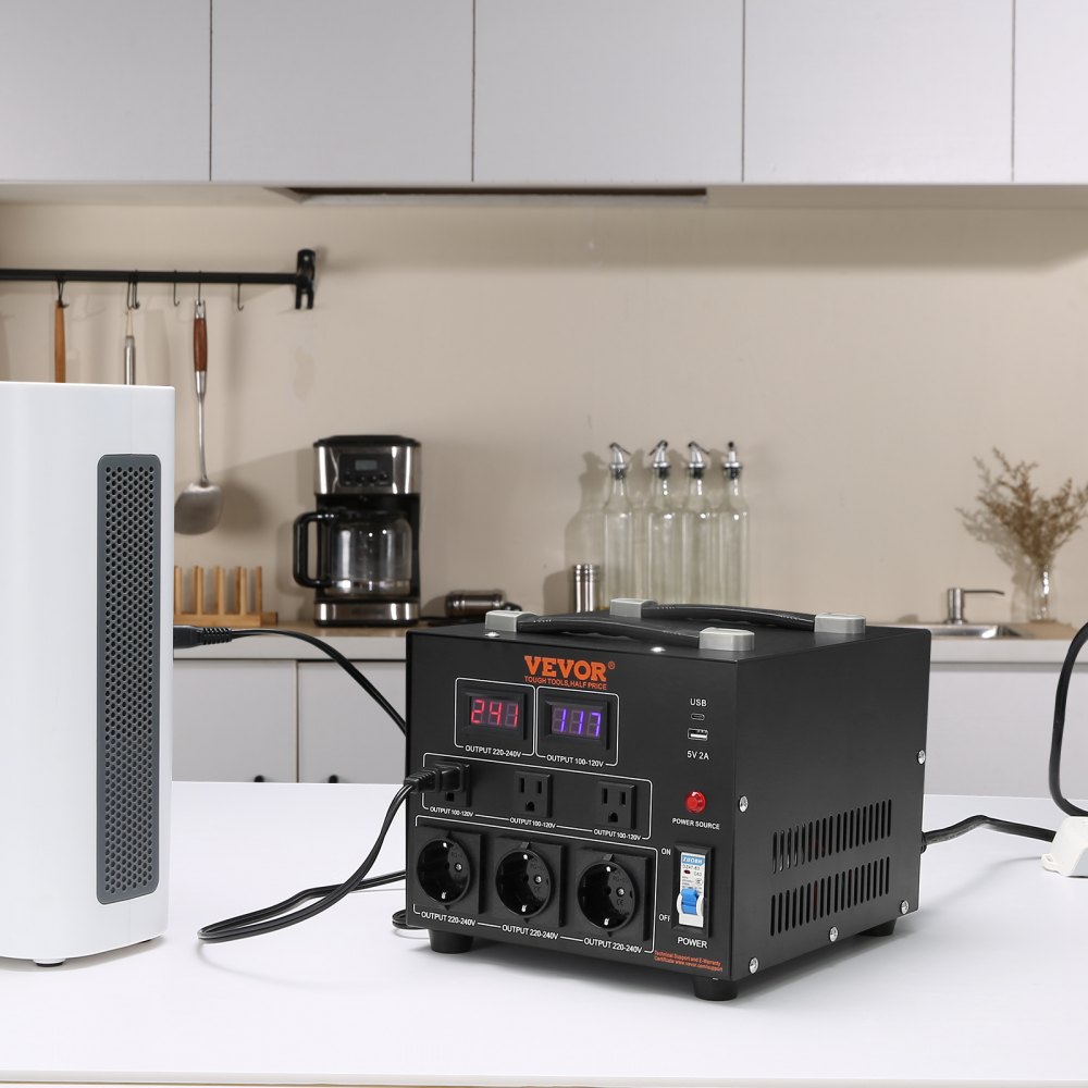 Transformador convertidor de voltaje VEVOR en una encimera de cocina, con electrodomésticos al fondo.