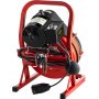 Máquina limpiadora de desagües VEVOR roja con motor negro y cables en espiral.