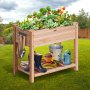 mesa de cultivo VEVOR con herramientas de jardinería y plantas en un jardín verde.