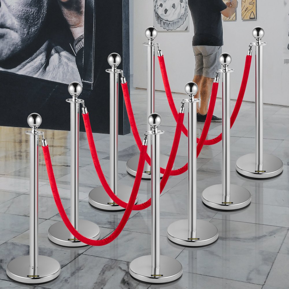 Puesto de control de multitudes VEVOR con cuerdas rojas en una galería de arte.
