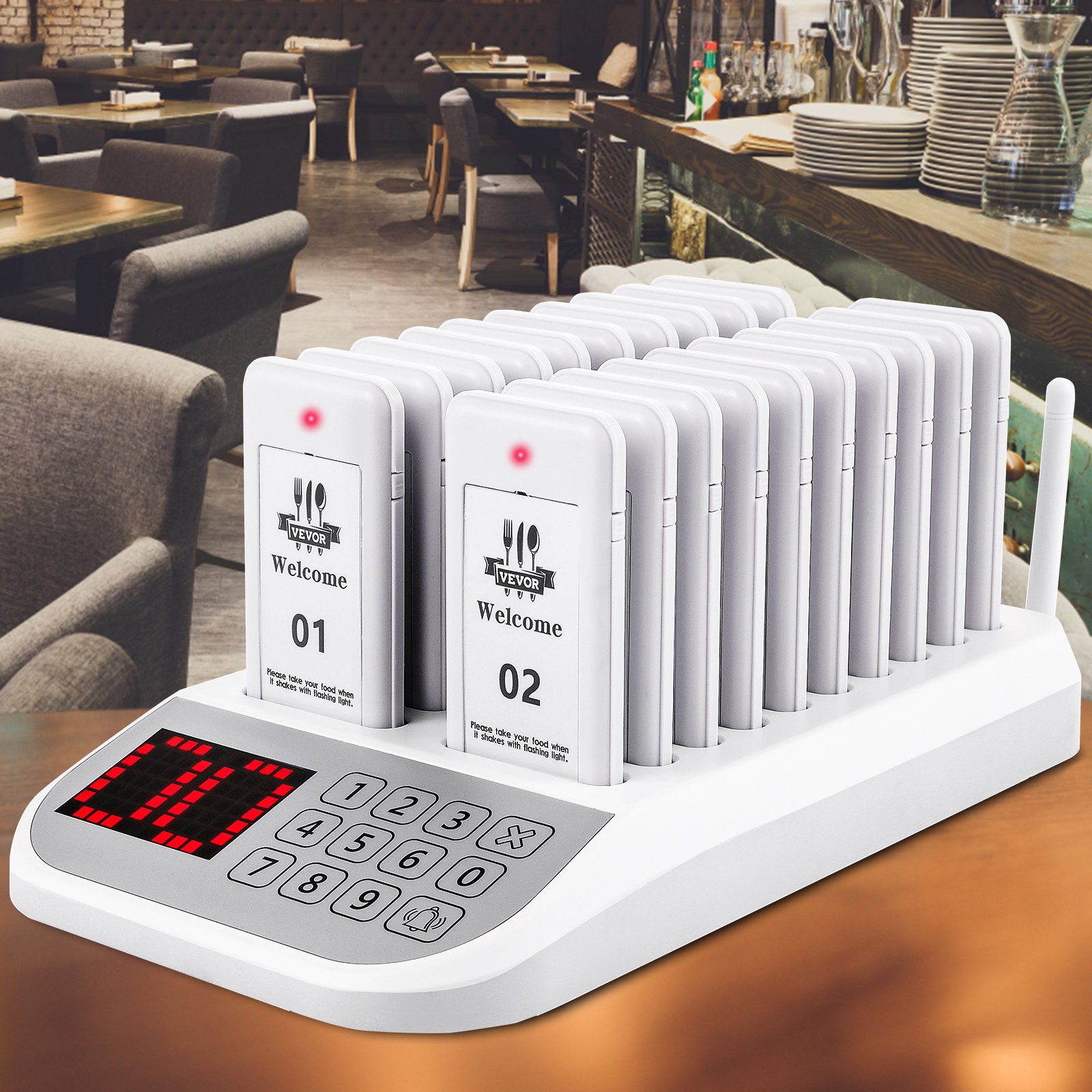 Sistema de buscapersonas de restaurante VEVOR sobre una mesa en un comedor moderno con platos y asientos.