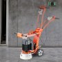 Amoladora de piso de concreto eléctrica VEVOR naranja con motor negro, estacionada sobre un piso de concreto pulido.