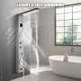 Baño moderno con panel de ducha LED VEVOR, bañera independiente y ventana grande.