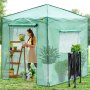 Invernadero emergente VEVOR con estanterías, plantas y estructura ensamblada en un entorno de jardín.