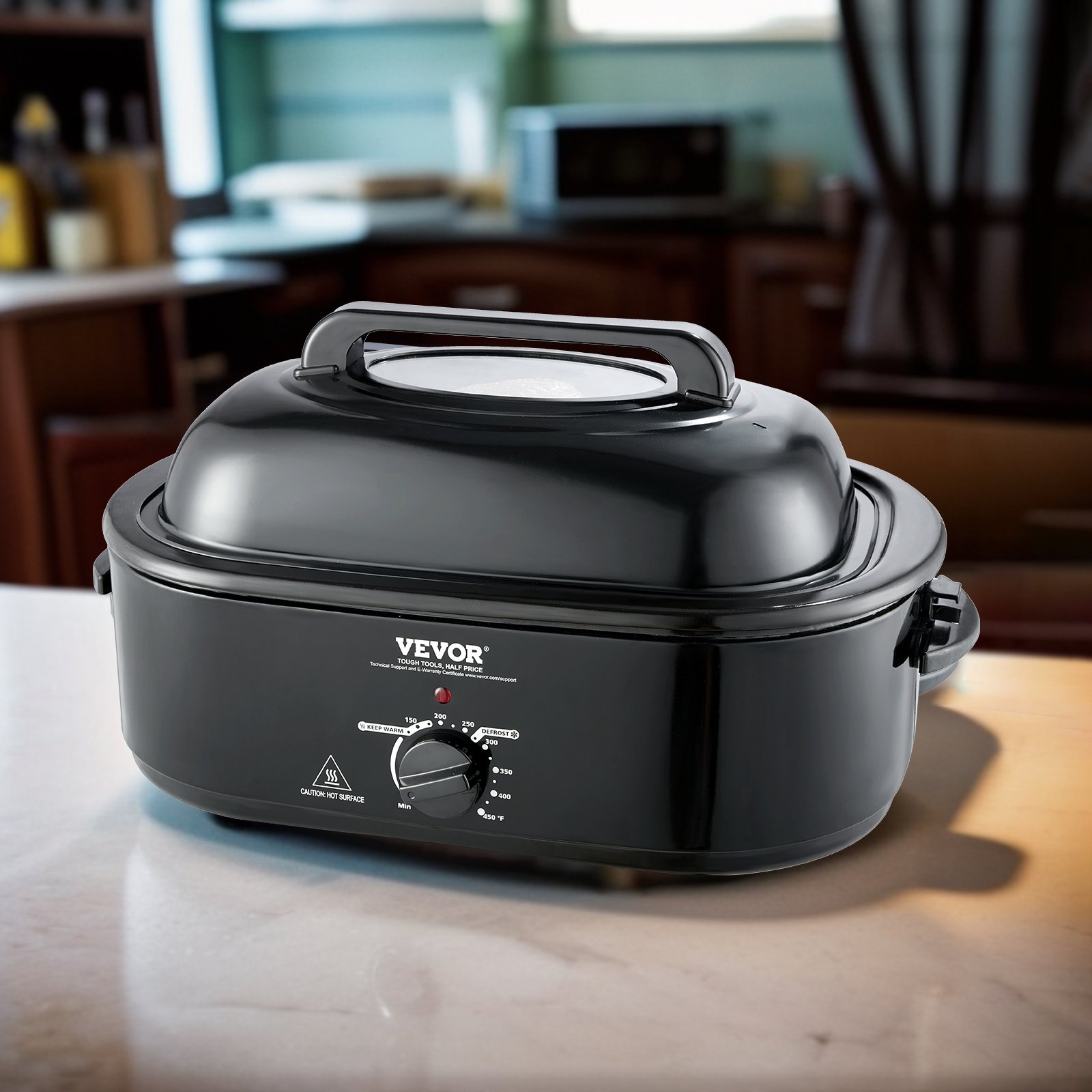 Horno tostador eléctrico VEVOR negro sobre encimera de cocina con perilla de control de temperatura ajustable.