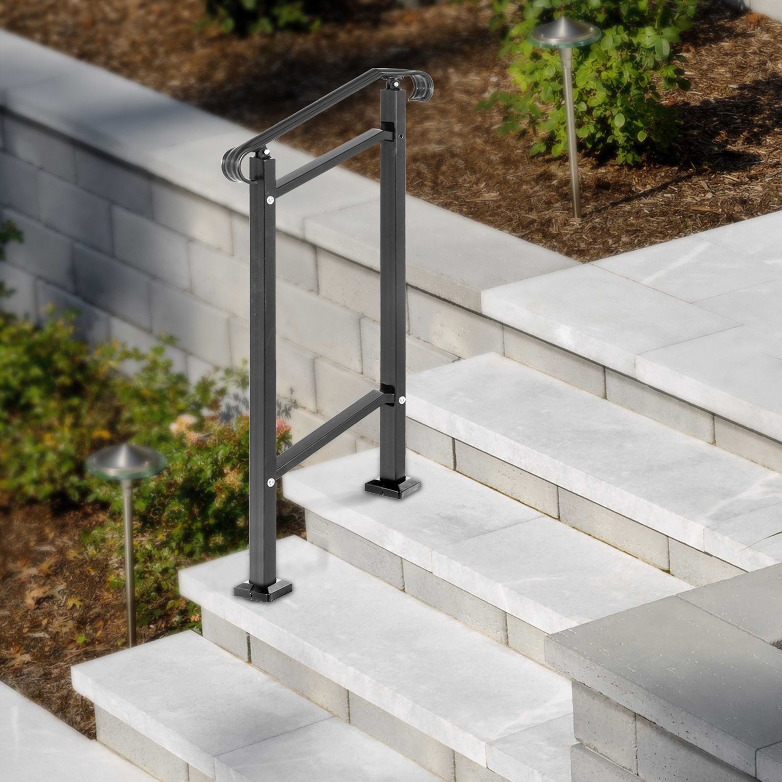 Barandilla de escalera exterior moderna VEVOR negra sobre escalera de piedra blanca con luces de jardín.