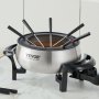 Olla de fondue eléctrica VEVOR con acabado en acero inoxidable y tenedores de fondue sobre encimera de mármol.