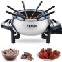 Olla de fondue eléctrica VEVOR con seis tenedores, chocolate, fresas y trozos de chocolate.