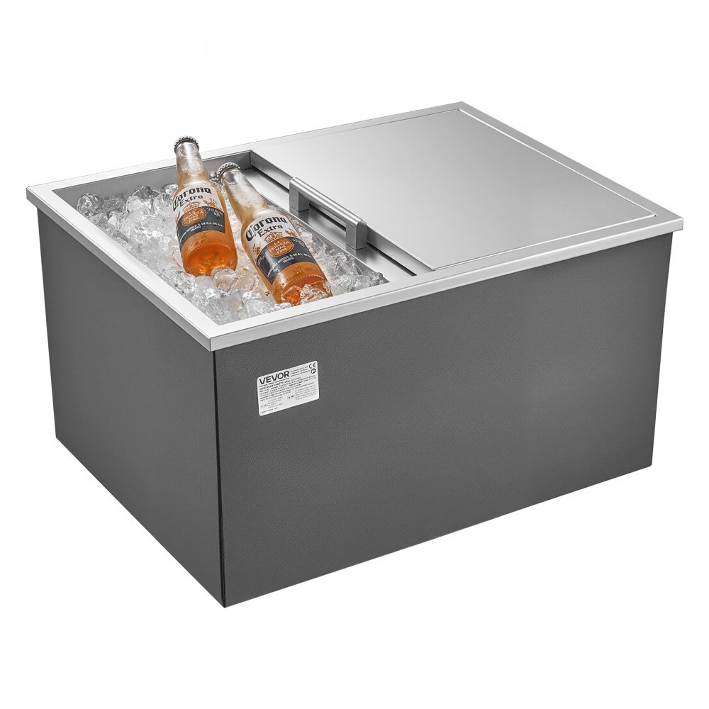 Hielera empotrable VEVOR, 61 cm de largo x 46 cm de ancho x 33 cm de alto, de acero inoxidable, con capacidad de 57.8 cuartos (54.5 litros) y tapa deslizante. Ideal para cocinas exteriores, patios y bares. Incluye juego de tubo de drenaje. Perfecta para enfriar vino y cerveza.