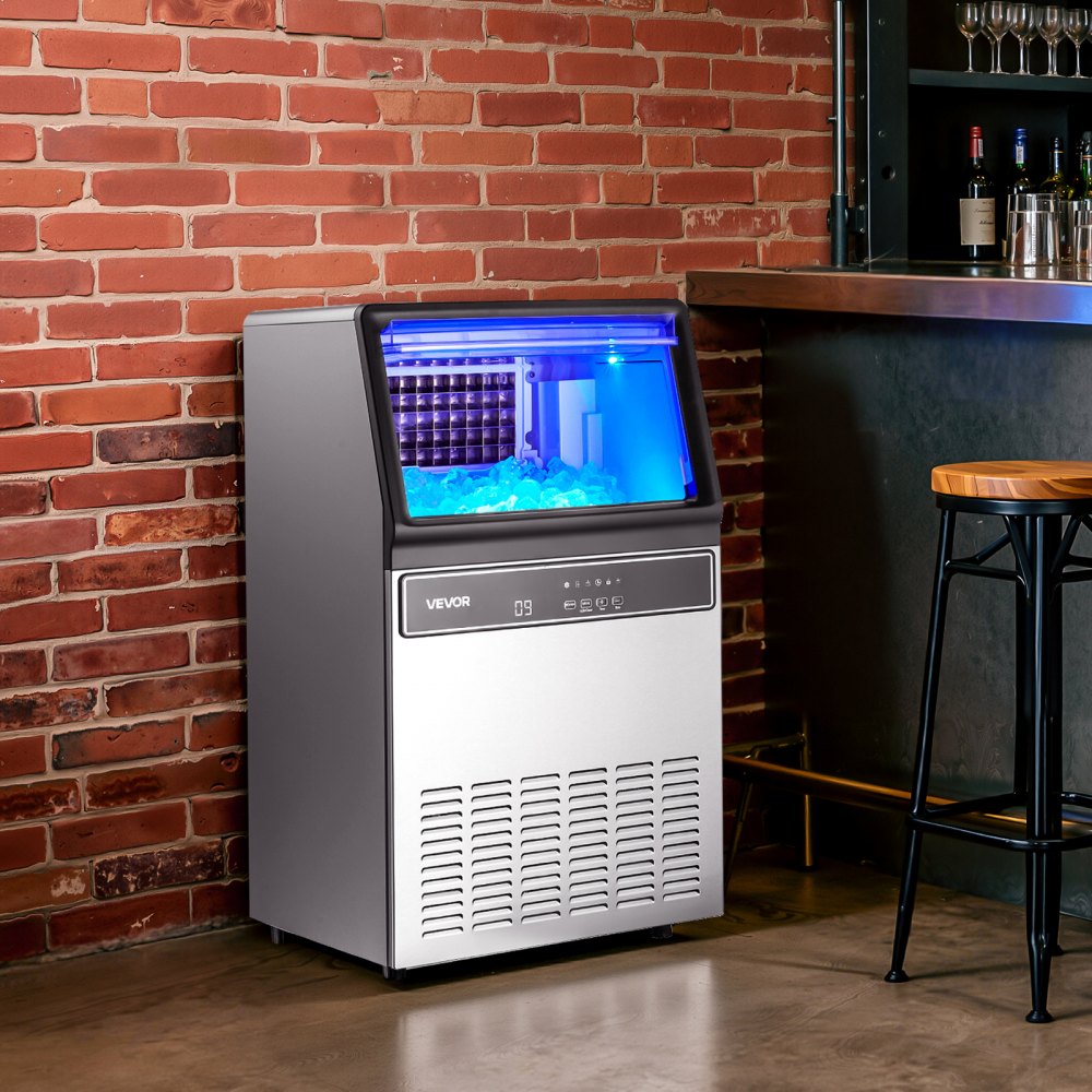 Máquina para fabricar hielo comercial VEVOR, 130 lb/24 h con capacidad de almacenamiento de 33 lb, 45 cubos por ciclo, de acero inoxidable, independiente y bajo encimera, con pantalla LED y autolimpieza, para casa, bar y restaurante.