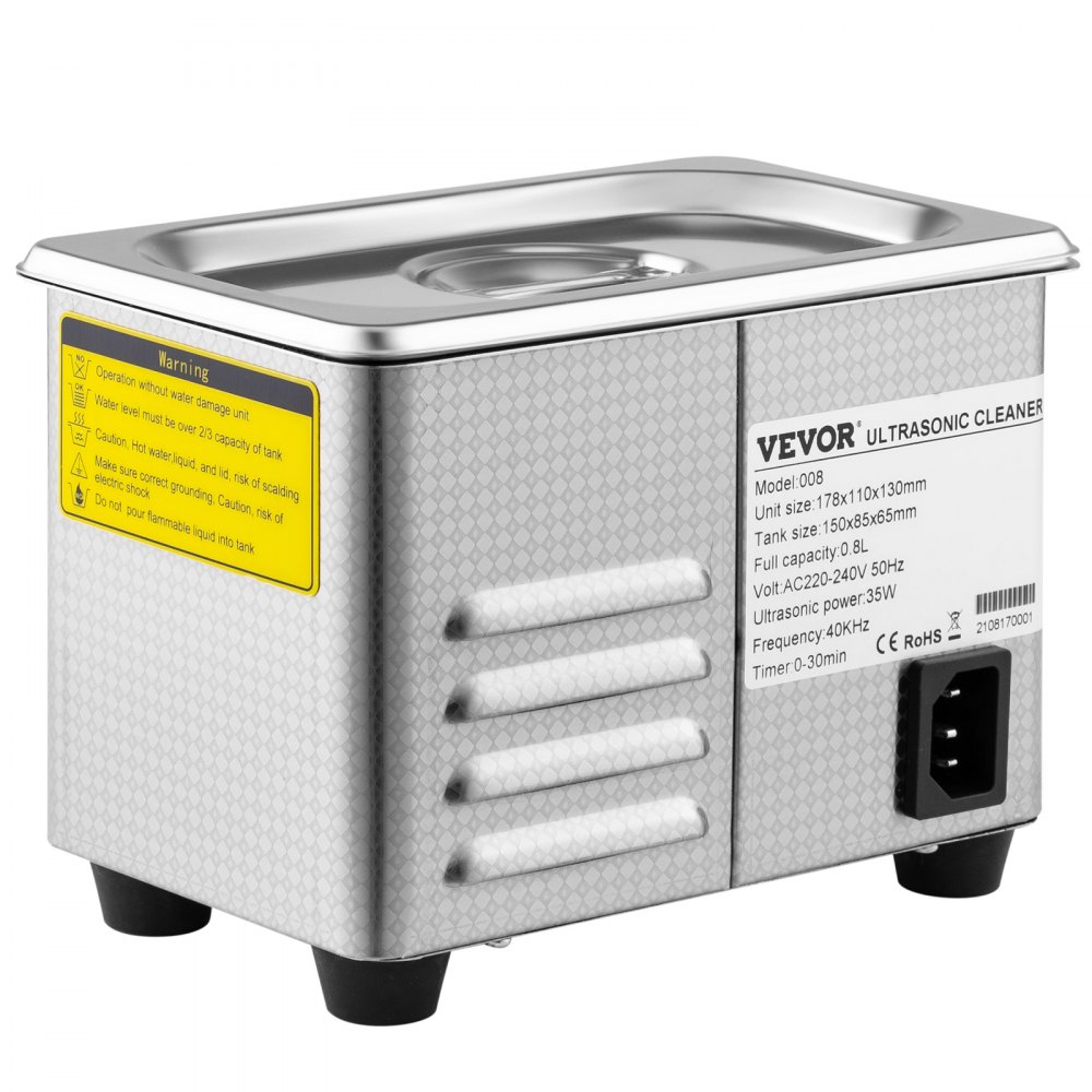 Limpiador ultrasónico VEVOR, cuerpo de acero inoxidable con advertencias y controles de seguridad.