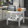 Parrilla de acero inoxidable VEVOR con horno, platos y utensilios de cocina en una cocina moderna.