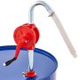 Bomba de tambor VEVOR con manivela manual roja montada en un barril azul.