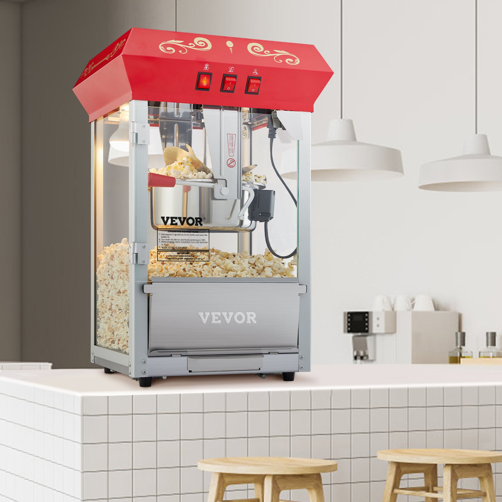 Máquina para hacer palomitas de maíz VEVOR en una cocina moderna con azulejos blancos y taburetes de bar.