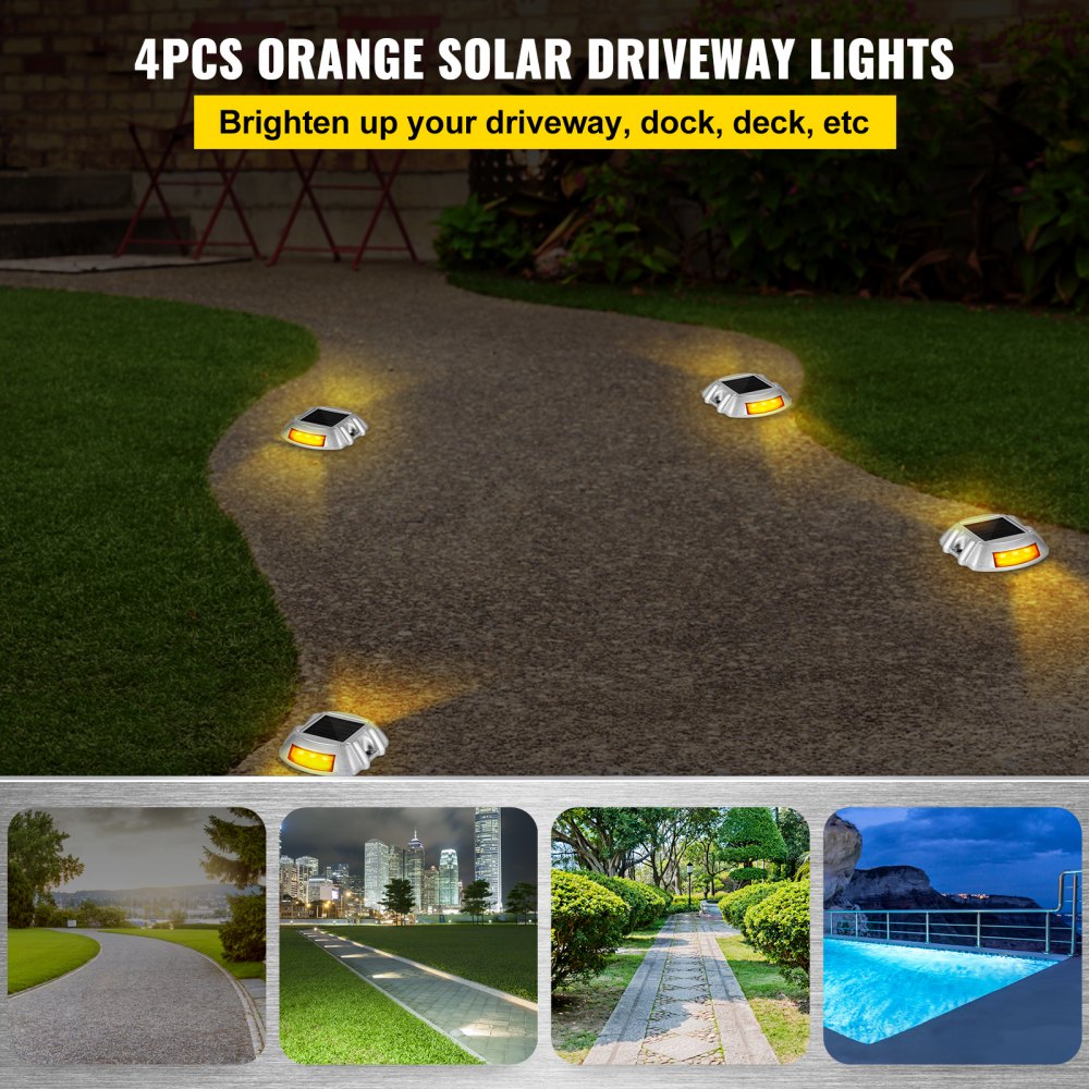 4 luces de entrada solares VEVOR de color naranja que iluminan un camino con un brillo naranja brillante.