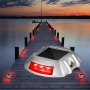 Luces de entrada solares VEVOR que iluminan un muelle de madera al atardecer con un brillo LED rojo.