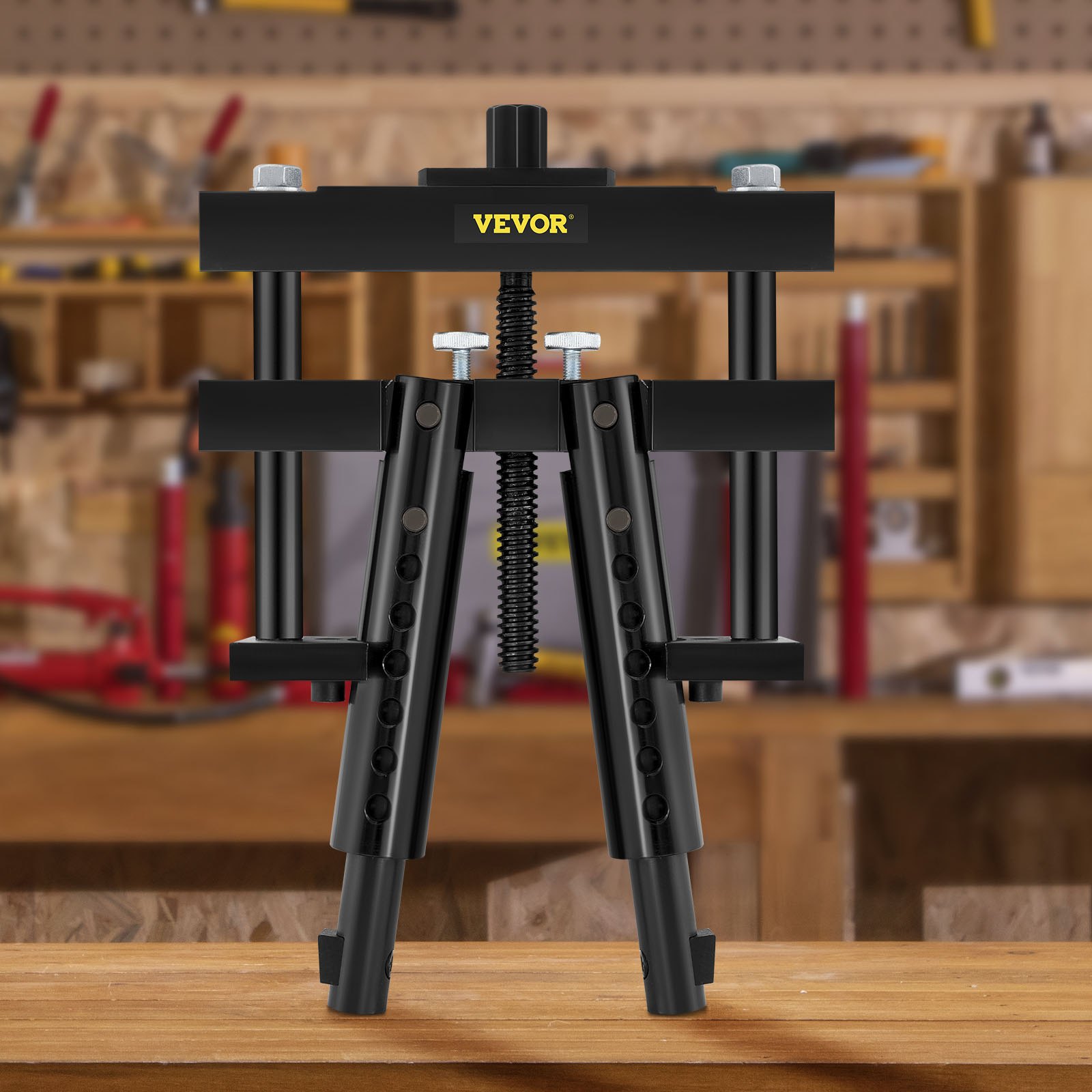Extractor de camisas de cilindro VEVOR exhibido en un banco de trabajo de madera en un entorno de taller.