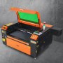 Grabador láser de CO2 VEVOR con tapa naranja abierta y ventana protectora verde sobre fondo gris.