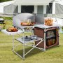 Configuración para acampar con mesa de cocina para acampar VEVOR, con alimentos, utensilios de cocina y almacenamiento.
