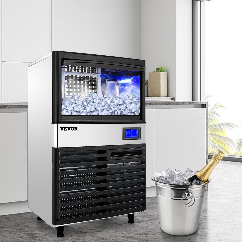 Máquina para fabricar hielo VEVOR en una cocina moderna con cubo lleno de hielo y champán.