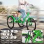 Persona conduciendo un triciclo plegable verde para adultos VEVOR con una cesta llena de comestibles en un día soleado.