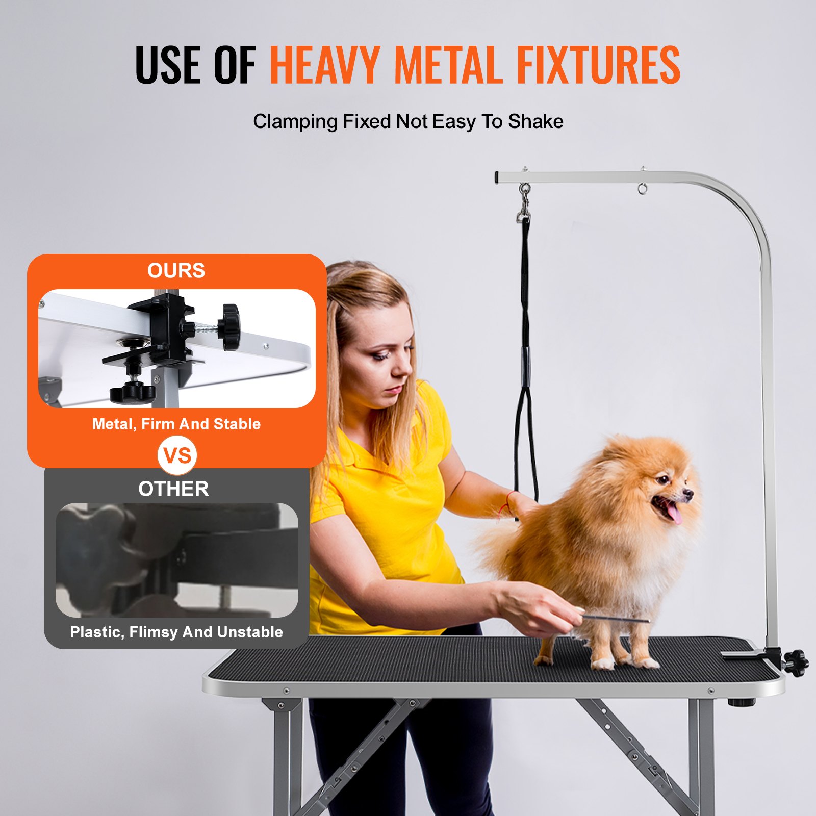 Mesa de aseo para mascotas VEVOR con accesorios de metal pesado, sujeción estable y un perro sonriente siendo acicalado.