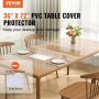 Funda de mesa transparente VEVOR de PVC de 36" x 72" sobre una mesa de comedor de madera con platos, cubiertos y un florero.